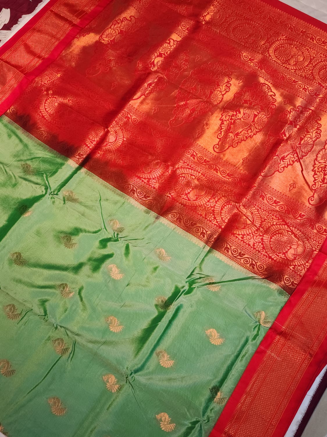 Serene Mint Green Paithani Saree with Fiery Red Kadiyal Border