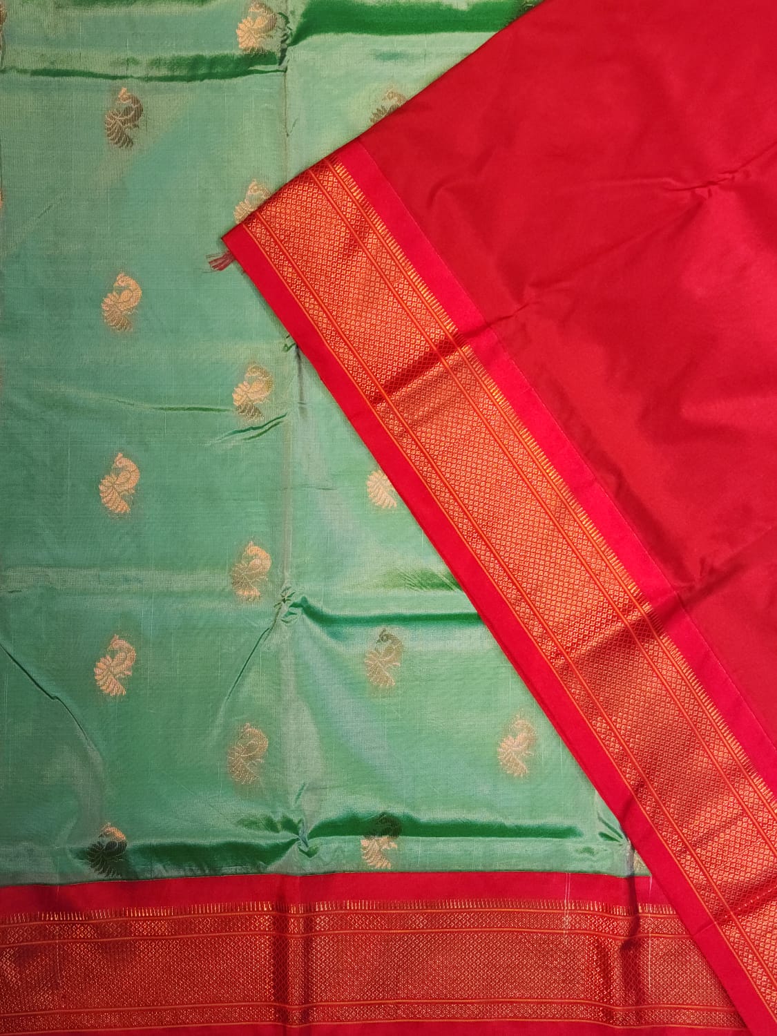 Serene Mint Green Paithani Saree with Fiery Red Kadiyal Border