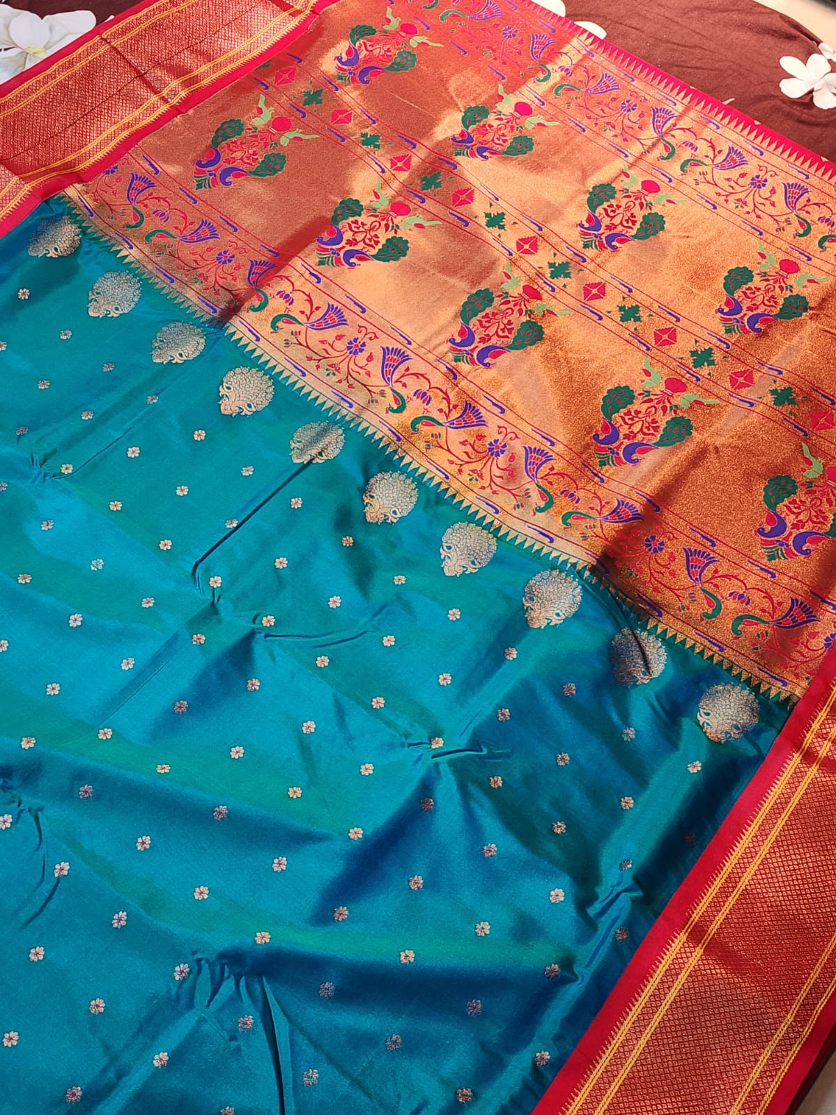 Teal Blue Paithani saree with vibrant red Kadiyal border