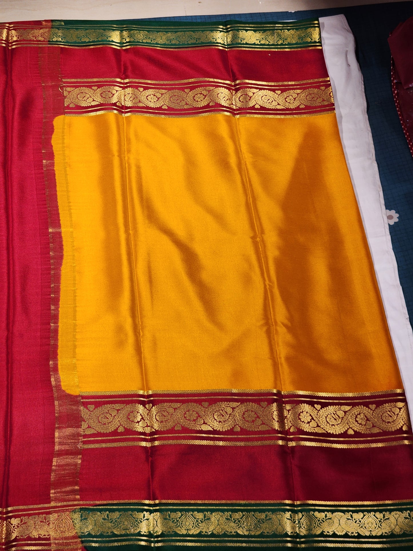 Mysore Silk Saree in Marigold Orange, Rich Red & Emerald Green with Floral Zari Border