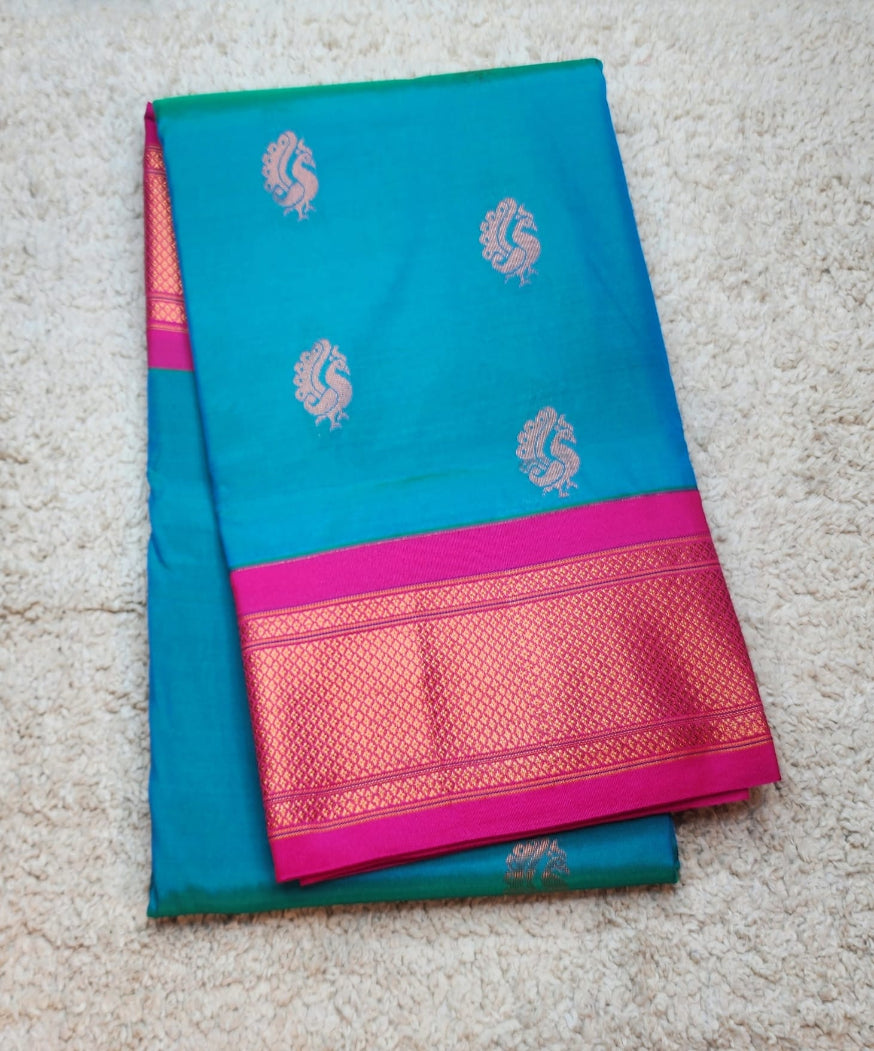 Teal Blue Paithani Saree with Pink Kadiyal Border