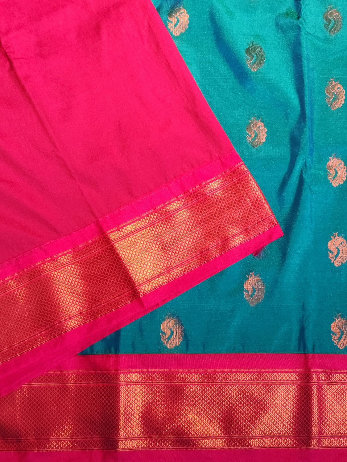 Teal Blue Paithani Saree with Pink Kadiyal Border