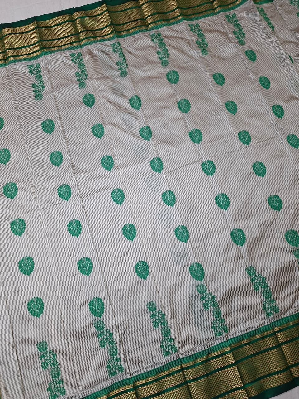 Off-white & green Ilkal Silk saree with floral weavings