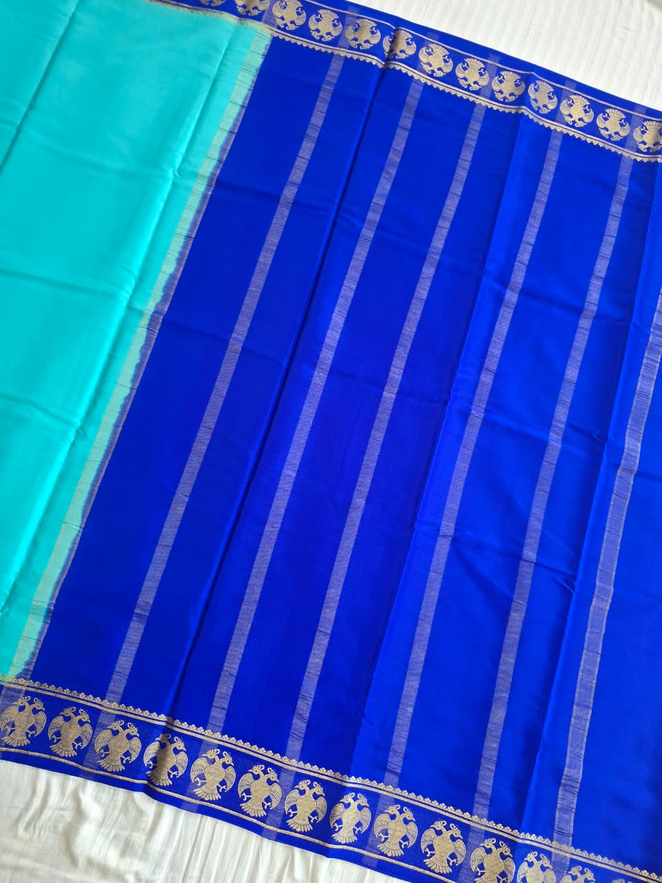 Sky Blue Mysore Crepe Silk with darke border-gandberunda motifs