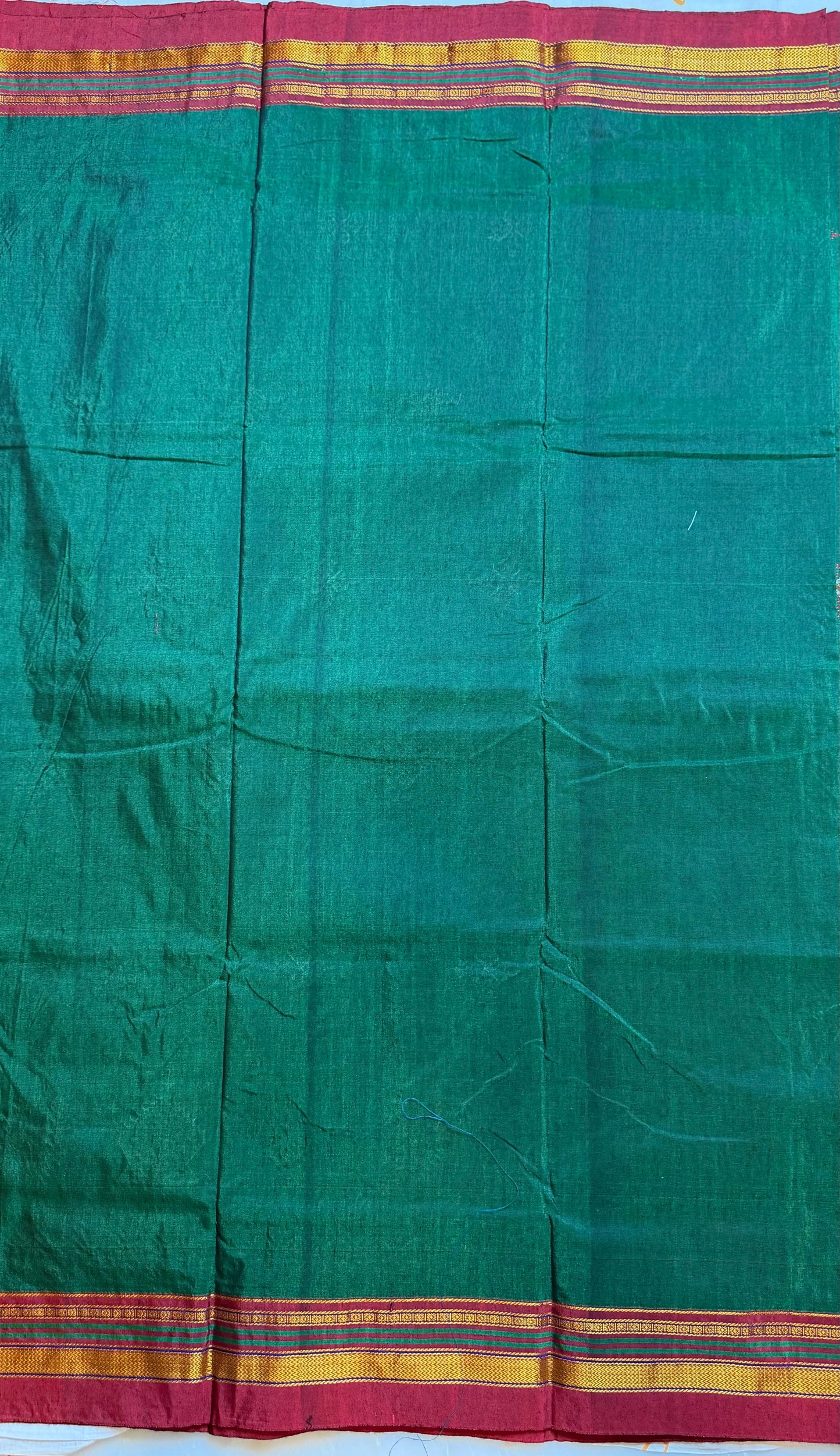 bright green kasuti saree with peacock design