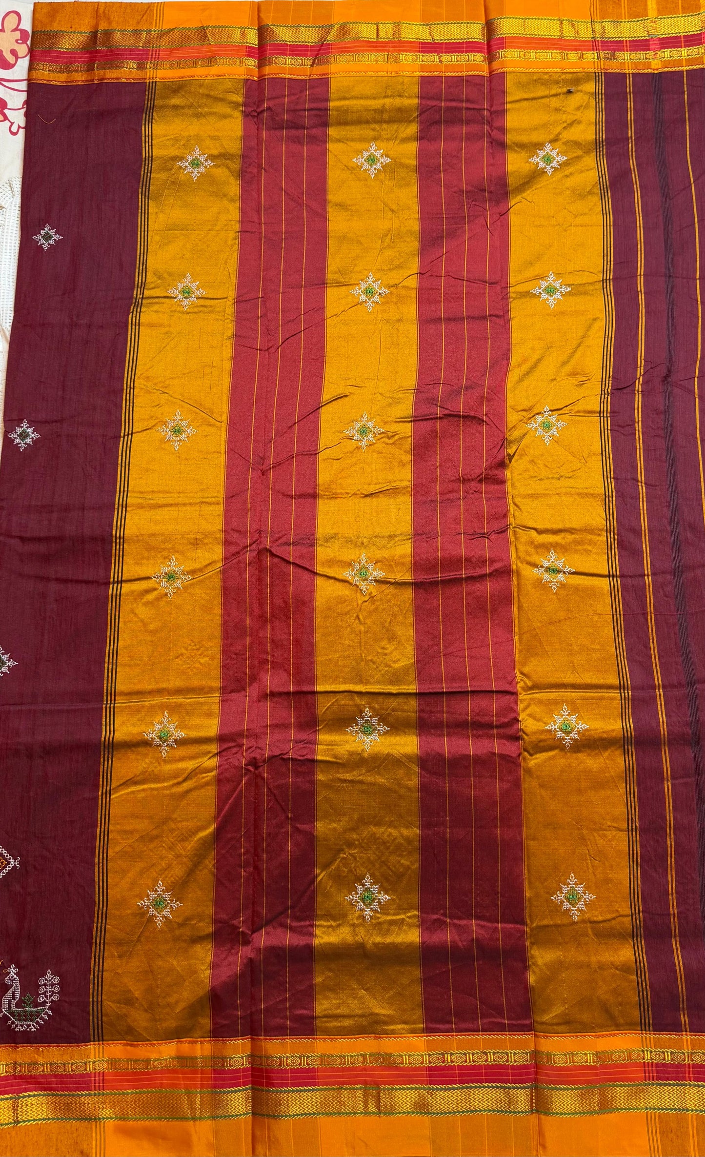 maroon kasuti saree with peacock design