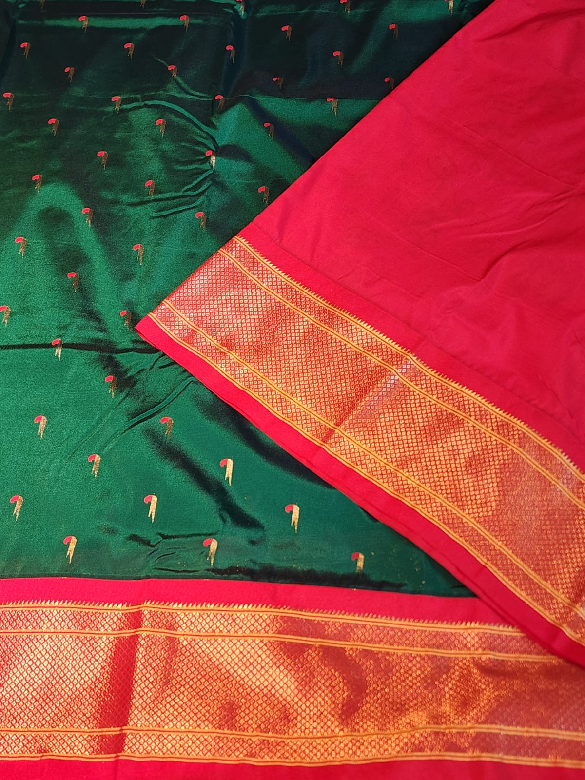 Bottle Green Paithani Saree with red Kadiyal border and muniya motif
