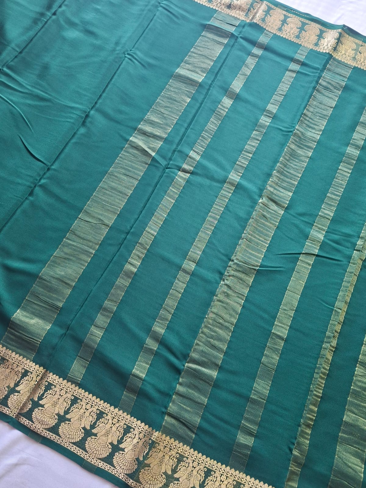 dark green mysore crepe pure silk with gandaberunda border