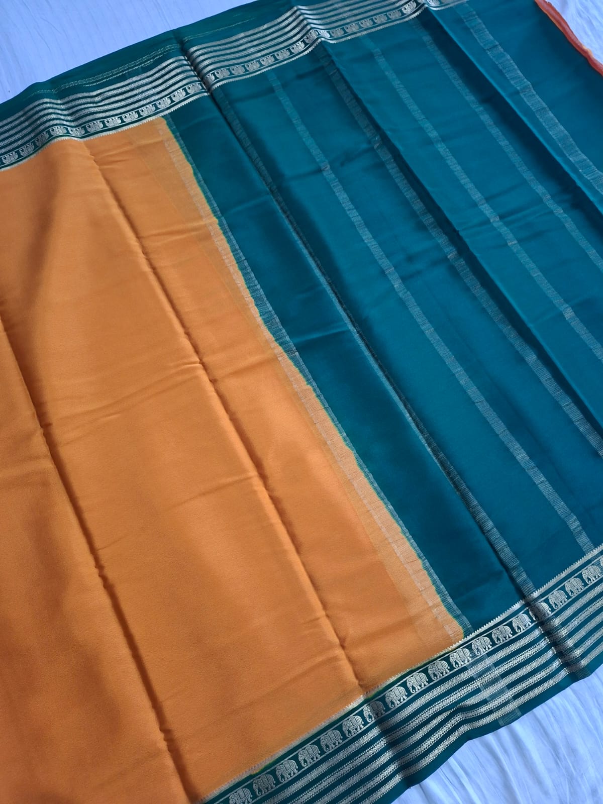 mustard-gold mysore crepe pure silk with elephant zari border