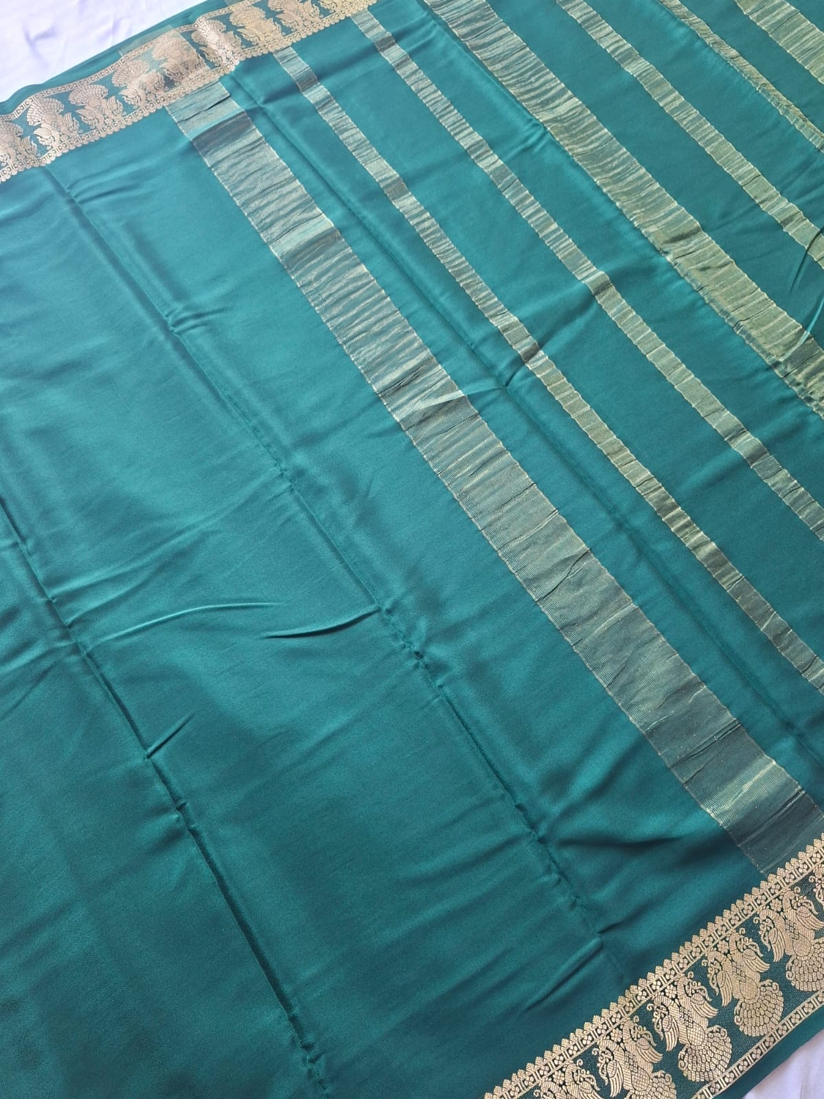 dark green mysore crepe pure silk with gandaberunda border