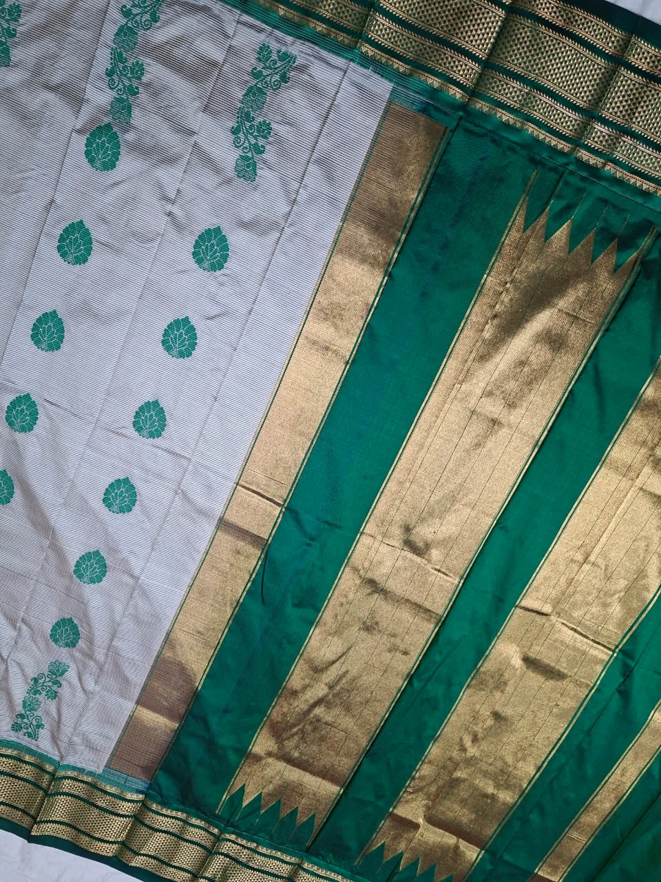 Off-white & green Ilkal Silk saree with floral weavings