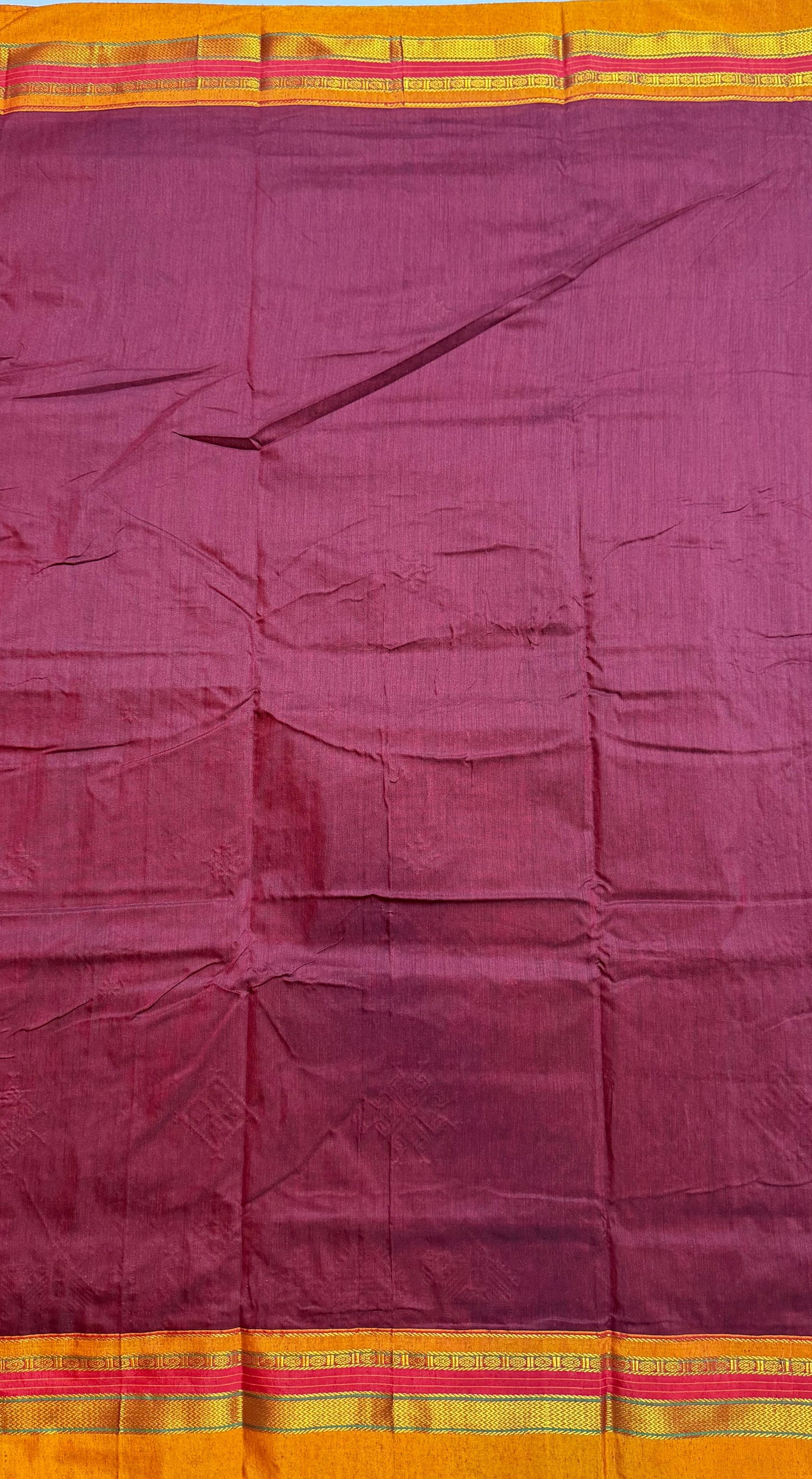 maroon kasuti saree with peacock design