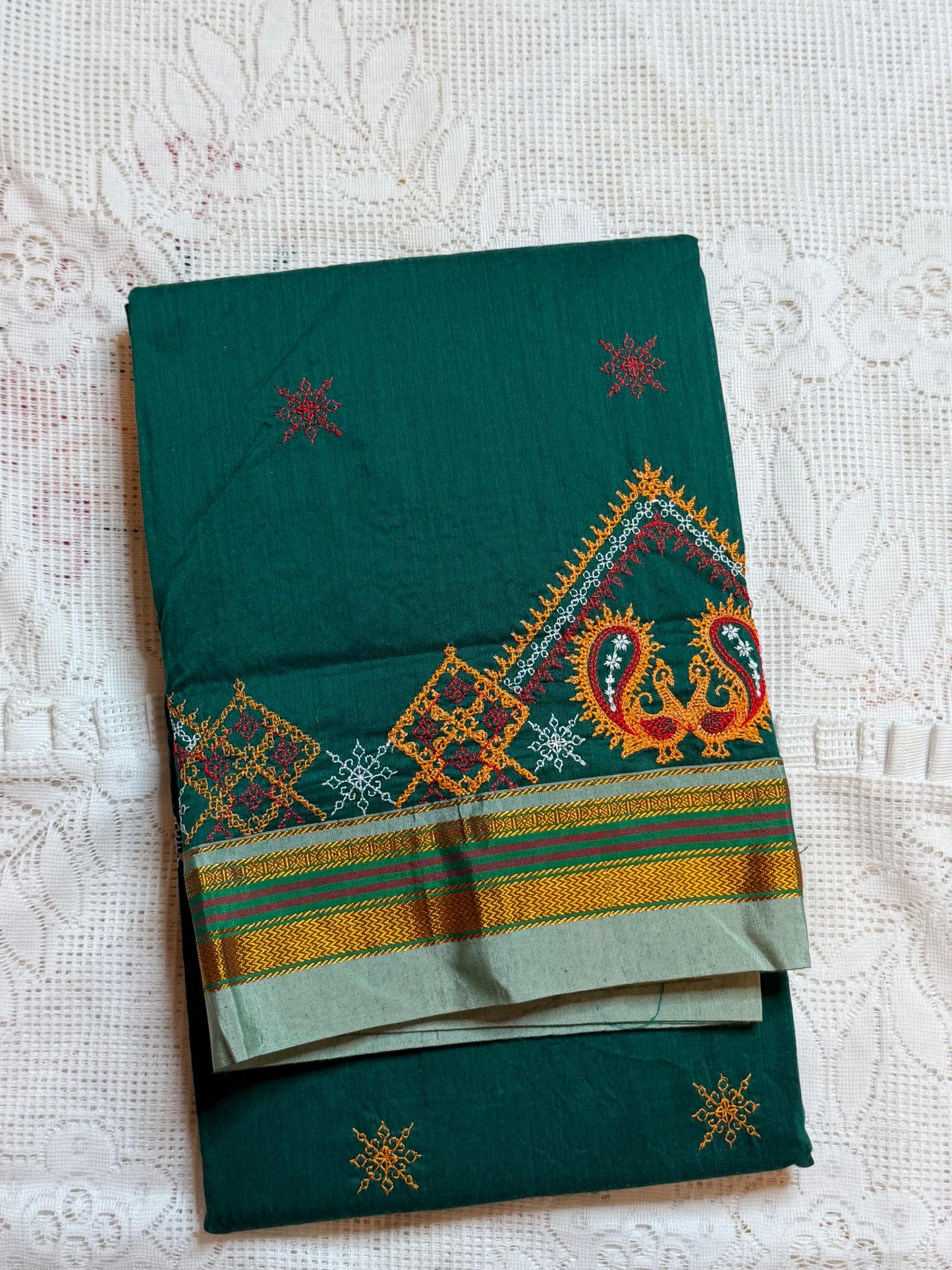 dark green kasuti saree with peacock design