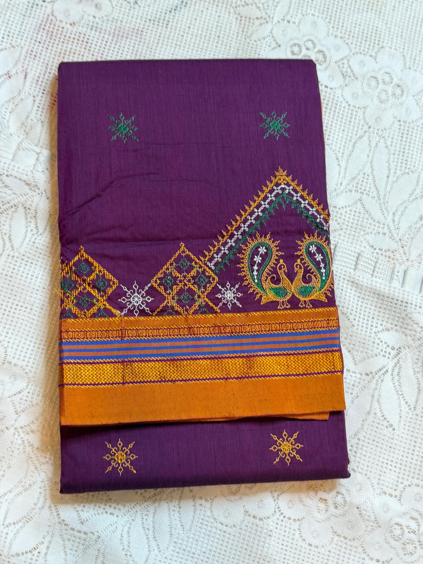 Purple kasuti saree with peacock design