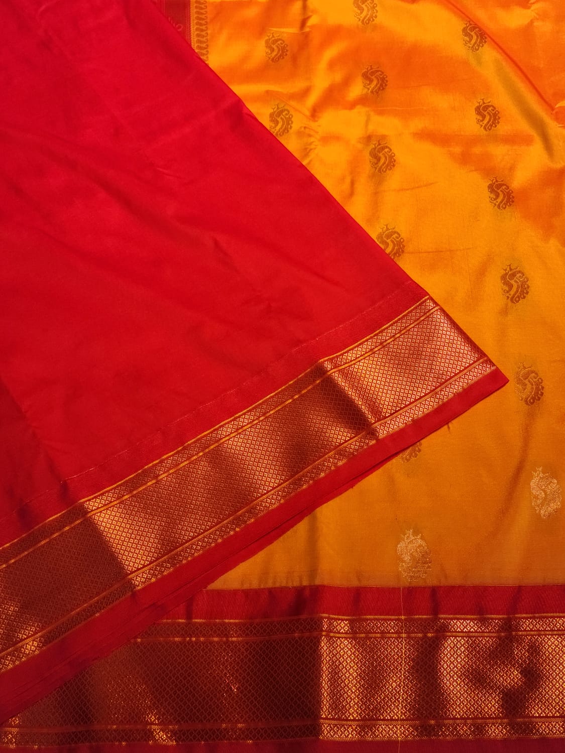 Orange Paithani Saree with Red Kadiyal Border