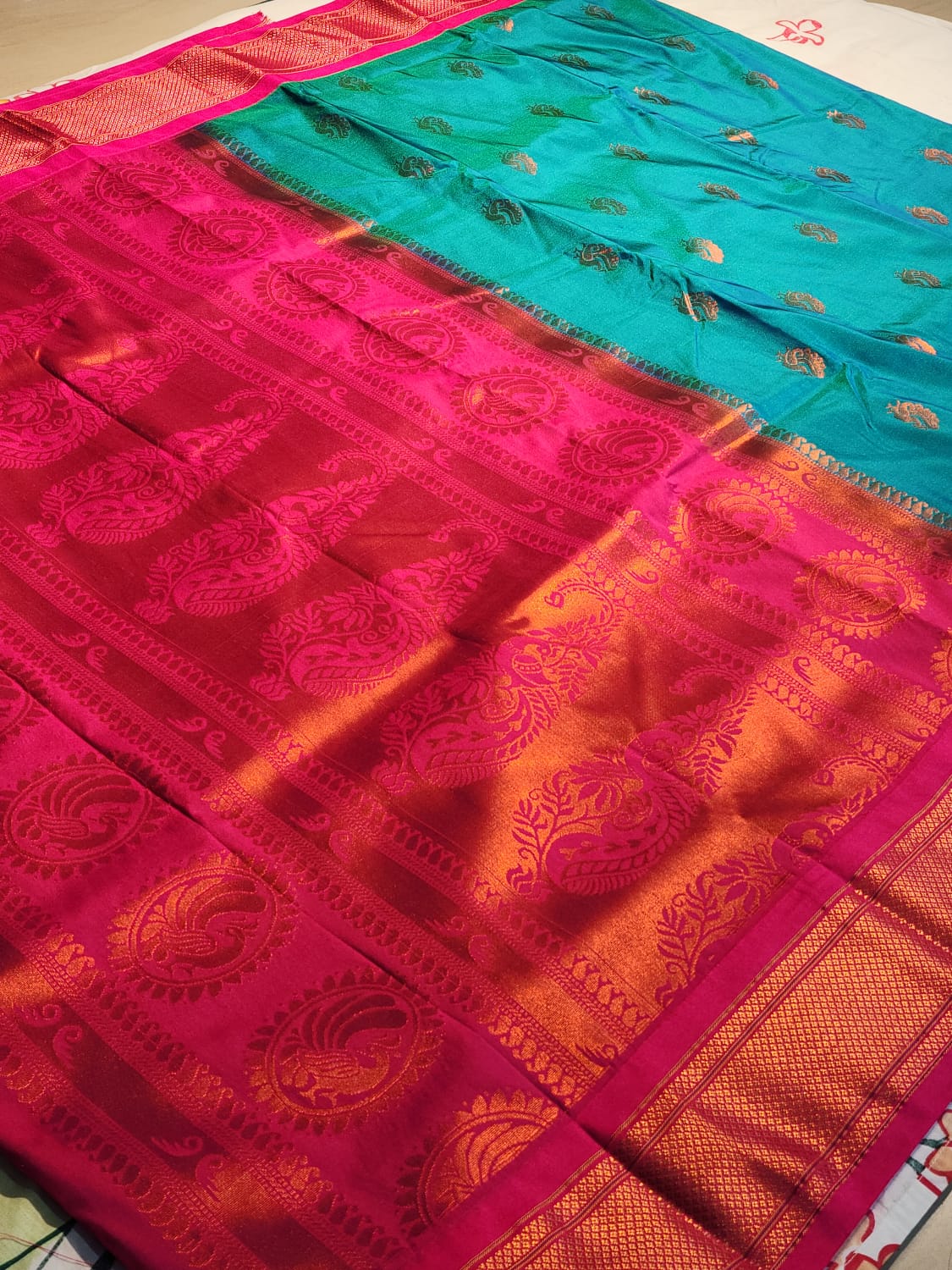 Teal Blue Paithani Saree with Pink Kadiyal Border