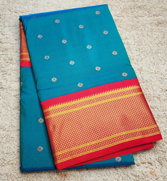 Teal Blue Paithani saree with vibrant red Kadiyal border