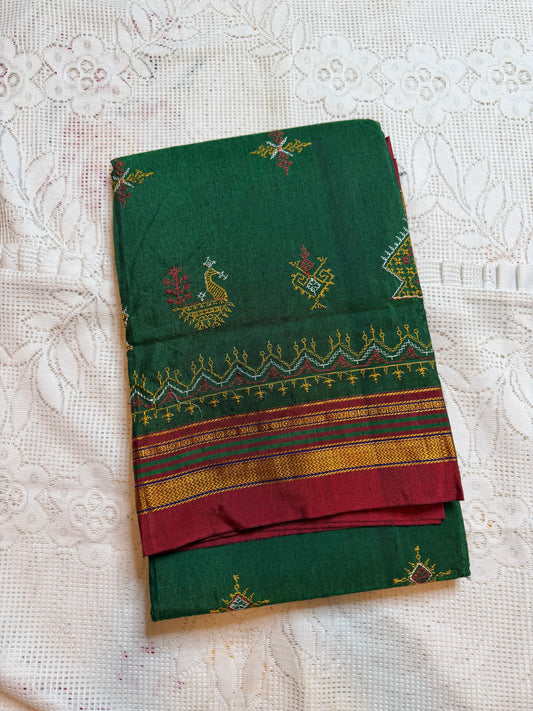bright green kasuti saree with peacock design