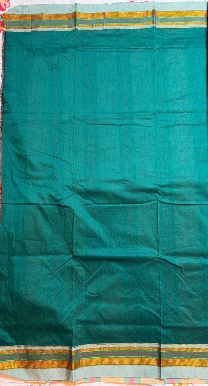 dark green kasuti saree with peacock design