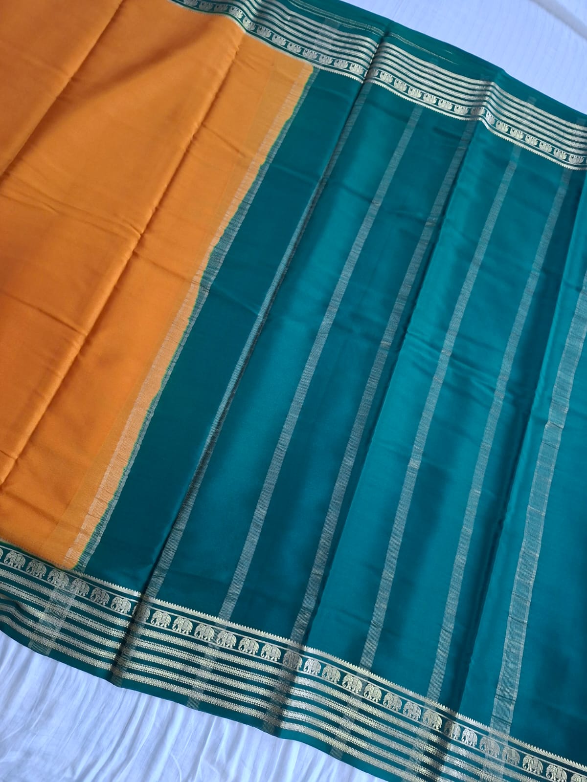 mustard-gold mysore crepe pure silk with elephant zari border