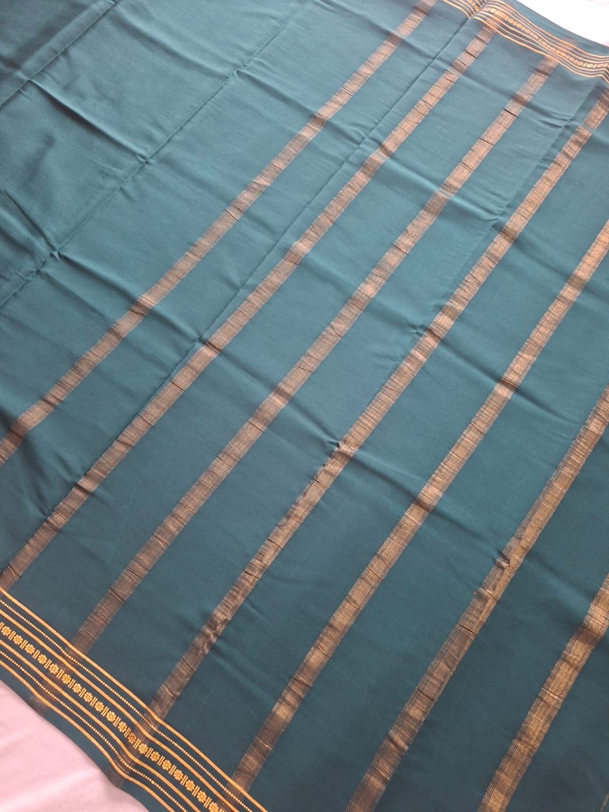 dark green mysore crepe pure silk with floral zari border