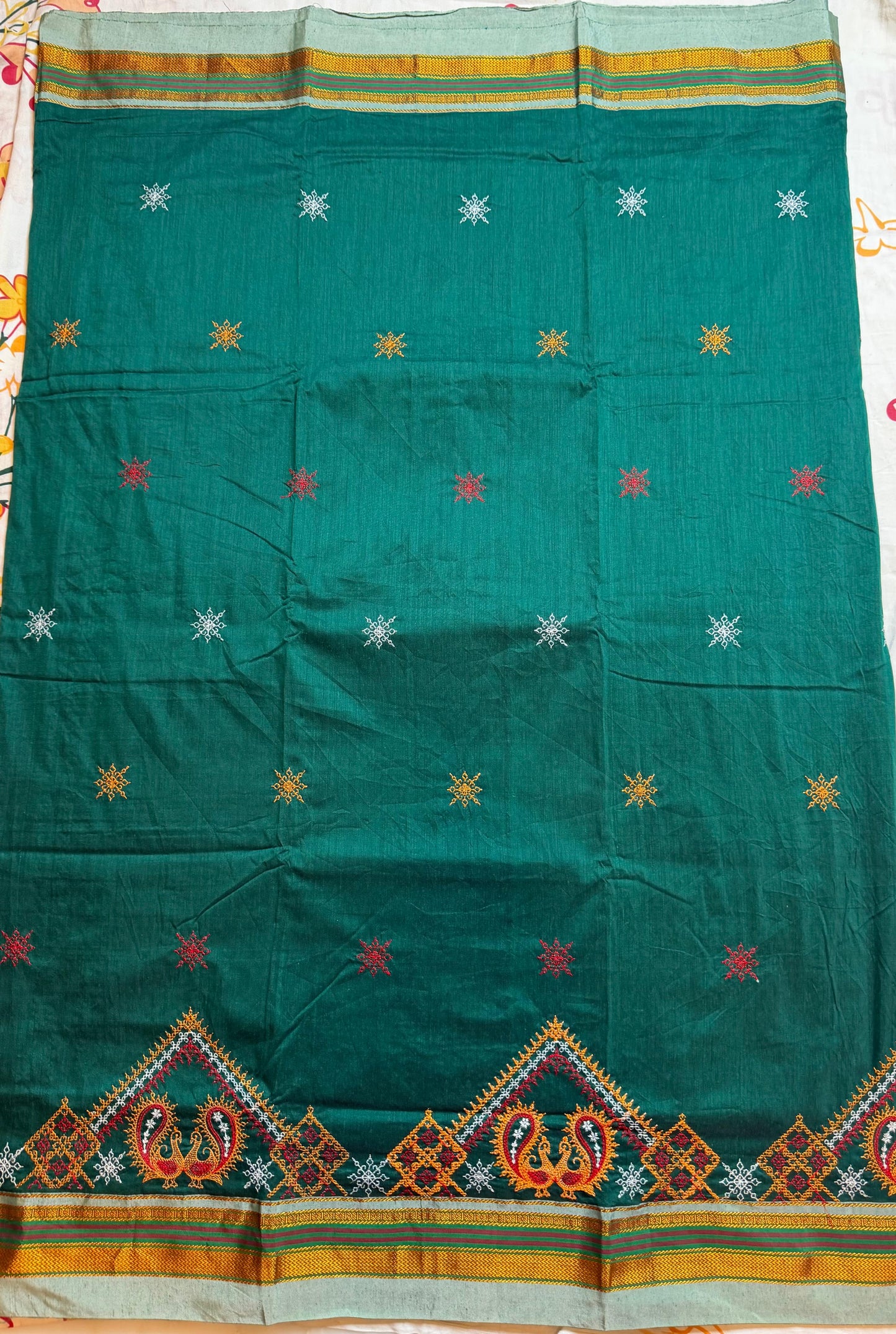 dark green kasuti saree with peacock design